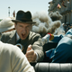 Ralph Fiennes in the back seat of a car screaming.